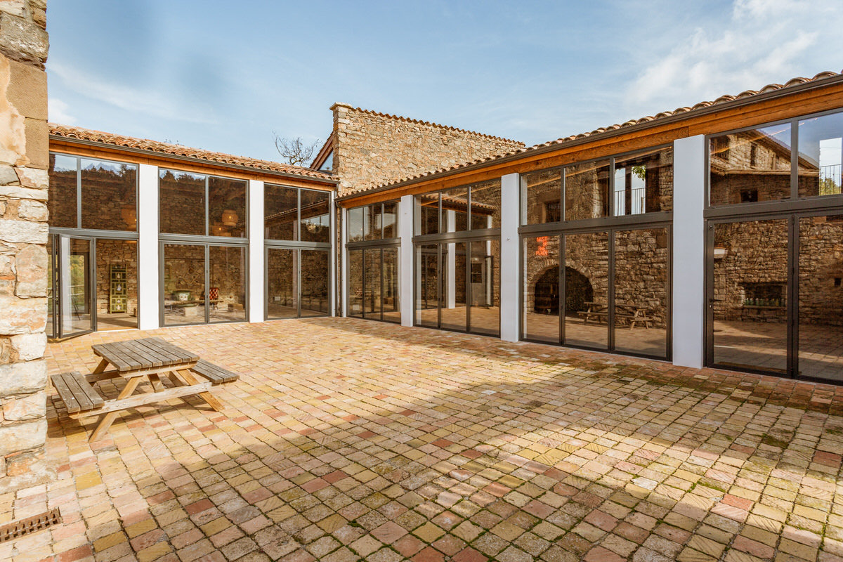 The central courtyard with brick paving and glass walls